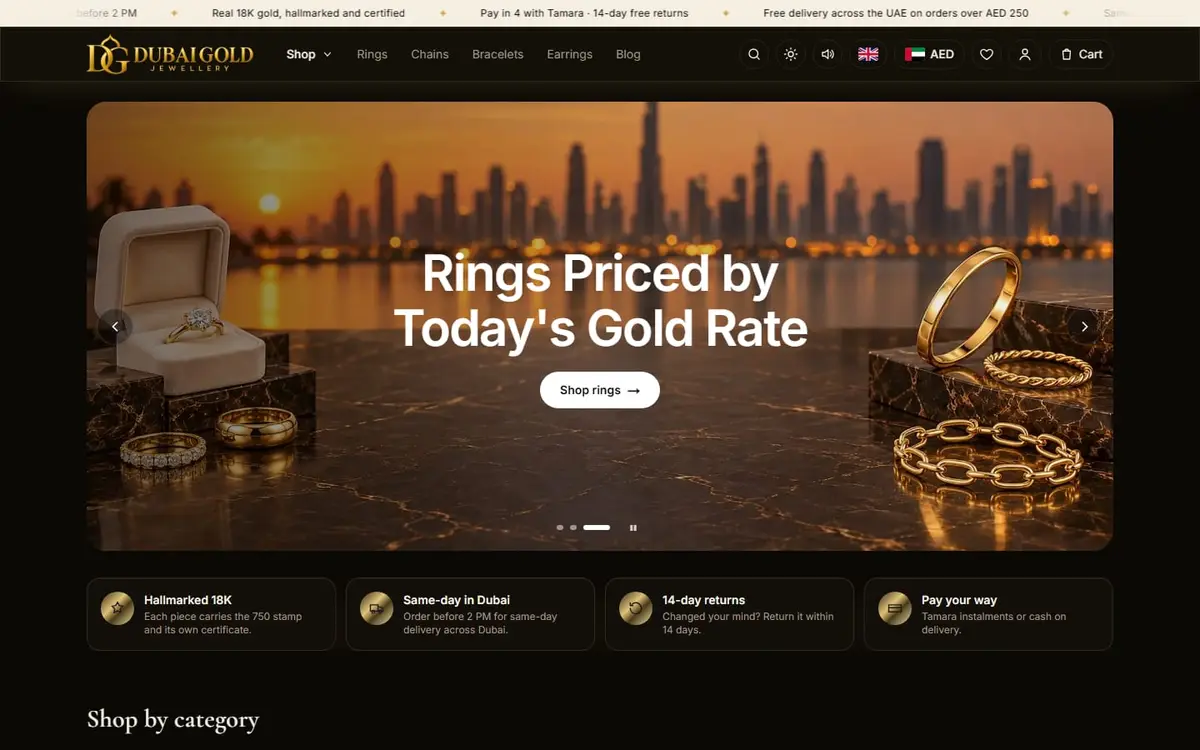 The Dubai Gold Jewellery homepage, featuring hallmarked 18K gold pieces.